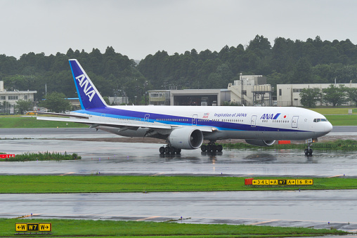 Tokyo, Japan - Jul 4, 2019.  JA732A All Nippon Airways Boeing 777-300ER taxiing on runway of Tokyo Narita Airport (NRT). Narita is one of the busiest airports in Asia.