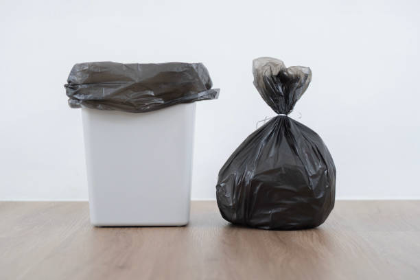istock Shot of Bag with garbage and rubbish bin put on floor in kitchen. 1744356333