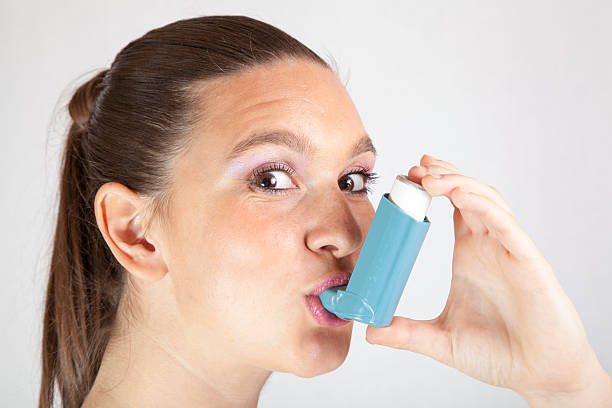 istock Cute girl with asthma inhaler 174436127