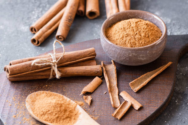 istock Cinnamon sticks and cinnamon powder on rustic background, healthy spice, (Cinnamomum) 1744371785