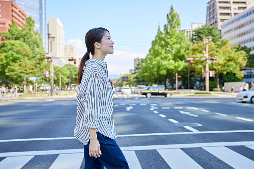 Japanese woman crossing the road