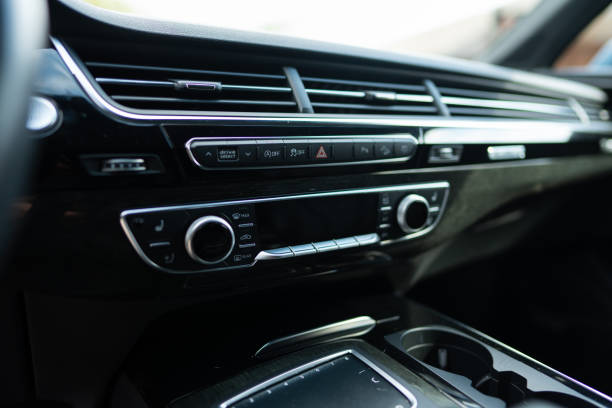 istock Car air conditioning system maintaining cool interior environment in hot weather. AC adjusting cabin temperature and fan speed inside expensive car models 1744379553