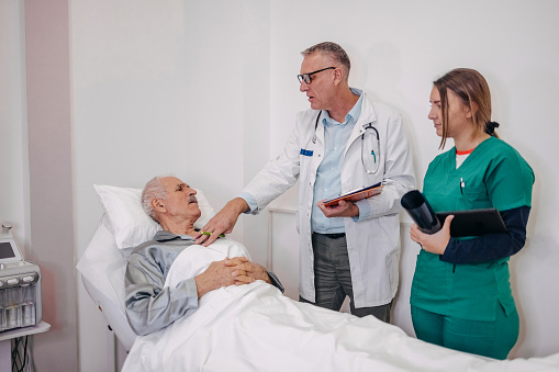 Old person having been checked by doctor at clinic