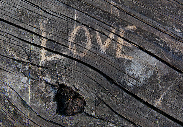 istock Love carved into wood 174438456