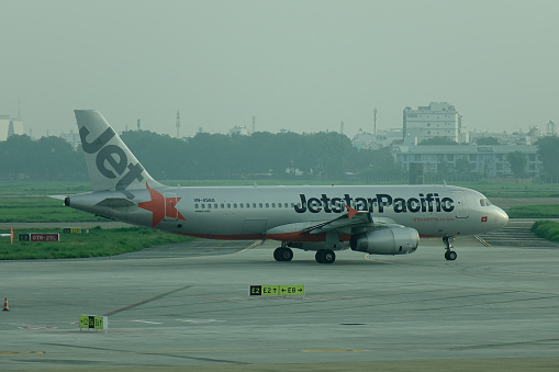 Saigon, Vietnam - Jun 3, 2019. Jetstar Pacific VN-A560 (Airbus A320) taxiing on runway of Tan Son Nhat Airport (SGN).
