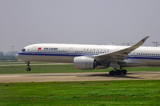 Shanghai, China - Jun 3, 2019. Airbus A350-900 airplane of Air China taking-off from the Shanghai Pudong Airport (PVG).