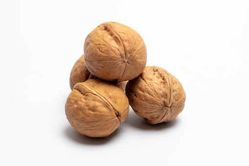 Studio Photography of Leatheroid Walnuts on White Background