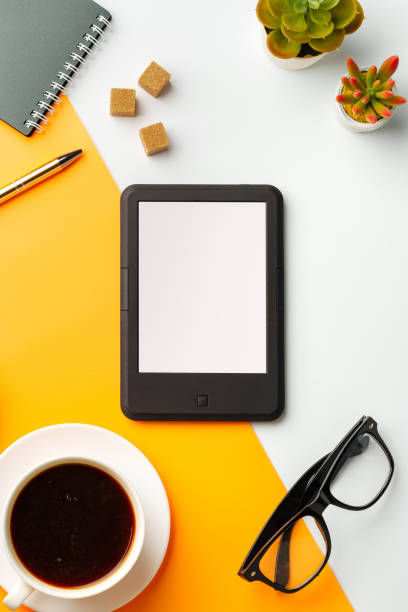 istock E-book reader with coffee cup and glasses on white and yellow background 1744441520
