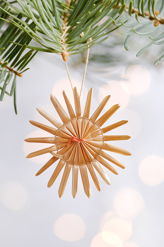 Straw ornament on christmas tree