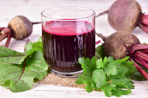 Beetroot juice in a glass. Healing vitamin drink made from beets.