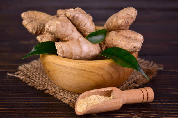 istock Fresh ginger root in a wooden bowl on a wooden table.Close-up. 1744460362