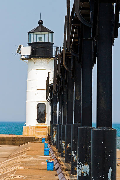 St. Joseph North Pier Outer Light, Michigan The outer and smaller of two lights on the North Pier at St. Joseph, Michigan with Lake Michigan behind. saint joseph stock pictures, royalty-free photos & images