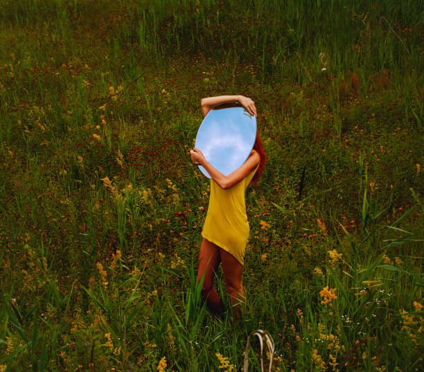 Young beautiful woman in green field