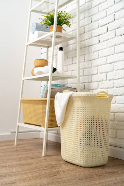 istock Beige plastic basket for laundry in a room 1744475247