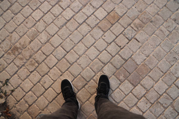 Feet standing on the ground