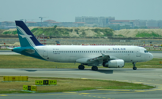 Singapore - Mar 28, 2019. 9V-SLO SilkAir Airbus A320 taxiing on runway of Singapore Changi Airport (SIN).