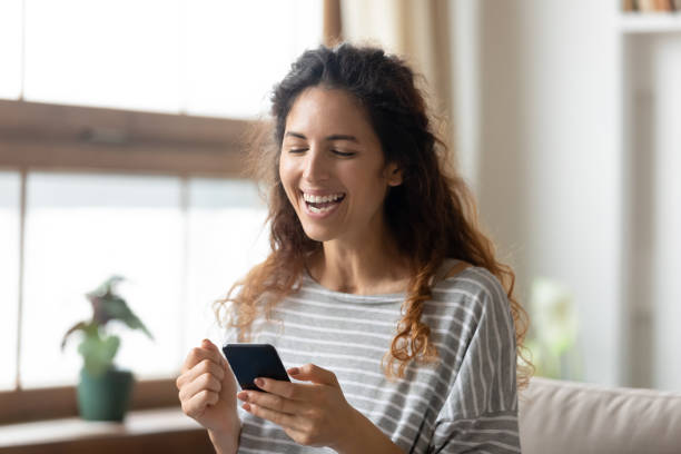 istock Excited girl feel euphoric winning lottery on cell 1744507845