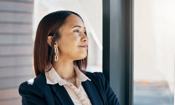 istock Smile, thinking and business woman in office, planning or problem solving in company. Future vision, idea and happy professional decision making, brainstorming solution and inspiration of strategy 1744511907
