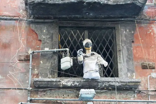 Pulcinella's mask at the window in the historic center in Naples, Campania, Italy