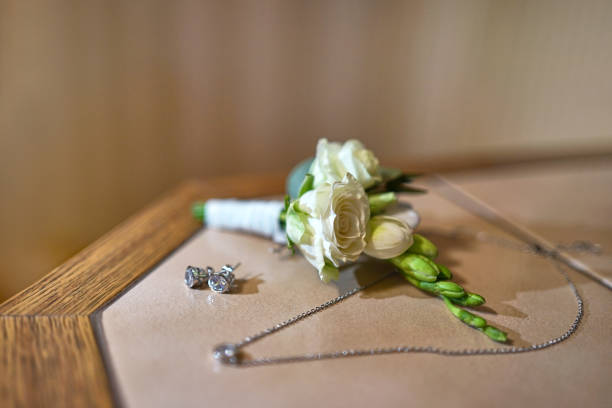 White rose and decorations on the table. Preparation for the wedding celebration.
