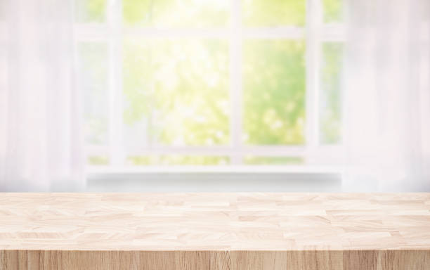 istock Selective focus.Wood table counter on blur curtain window in morning background. 1744547148