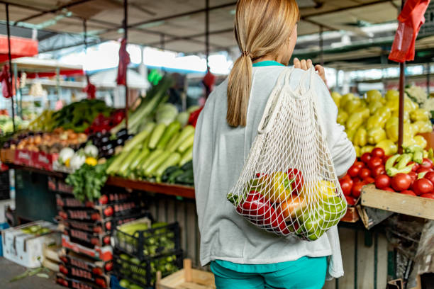 istock Vegetables and fruit in reusable bag on a farmers market, zero waste concept 1744580588