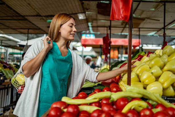 istock A young woman shopping for vegetables 1744580718