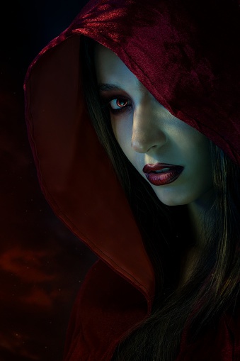 Witch wearing red cape