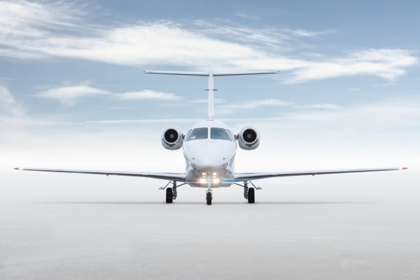 istock Front view of the modern white private jet isolated on bright background with sky 1744581773