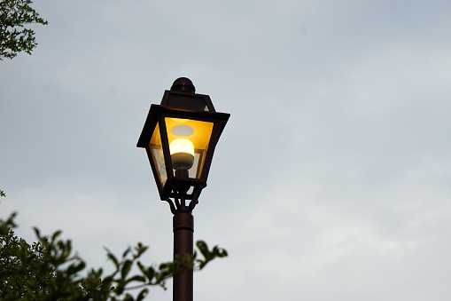 Illuminated street lamp in the morning.
