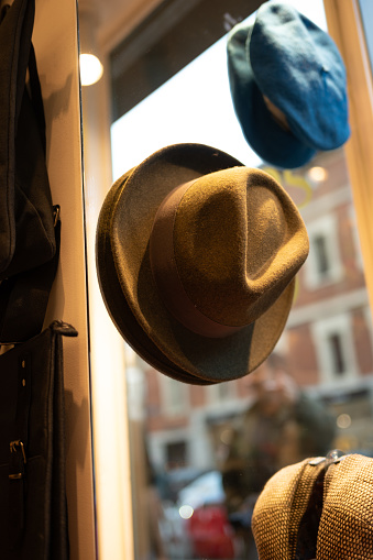 October 19, 2023; Madrid, Spain; A close-up of a fedora hat hanging on a white wall.