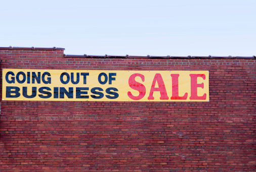 A sign advertising a going out of business sale.