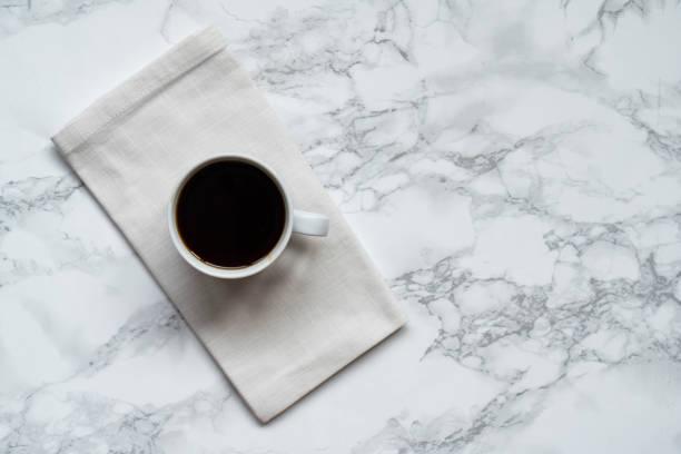 istock Cup of coffee on marble table 1744644258