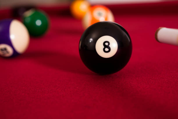 istock Sports: Eight ball on billiards table. Cue stick. 174466218