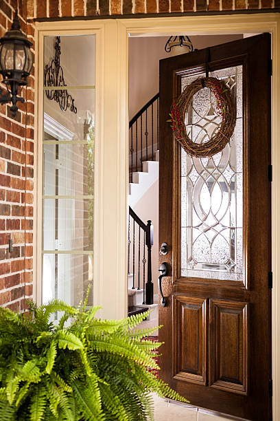 istock Open door with a twig wreath and red berries 174466332