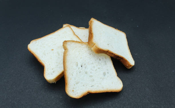 istock White Bread sliced on black background close-up view 1744671095