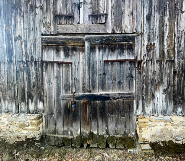 Medieval arched double doors, located at Chateau de Beynac et Cazenac, Dordogne, France