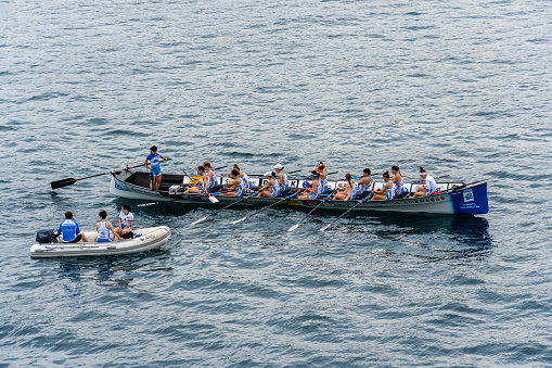 San Sebastian, Spain - July 8th, 2023: Trainera rowing boat regatta in the bay of La Concha in San Sebastian during Eusko Label and Euskotren 2023 league. Female competition. Amenabar boat before competition