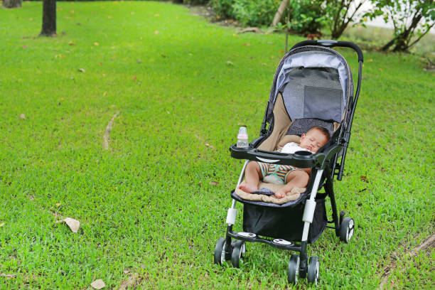 Beautiful baby girl sleeping in stroller.