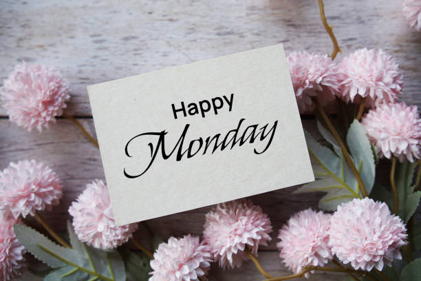 istock Happy Monday text message with flower decoration on wooden background 1744718849