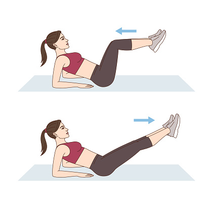 A woman is doing sports exercises. Crunch kicks. Workout for the abs and legs. Fitness for weight loss.
