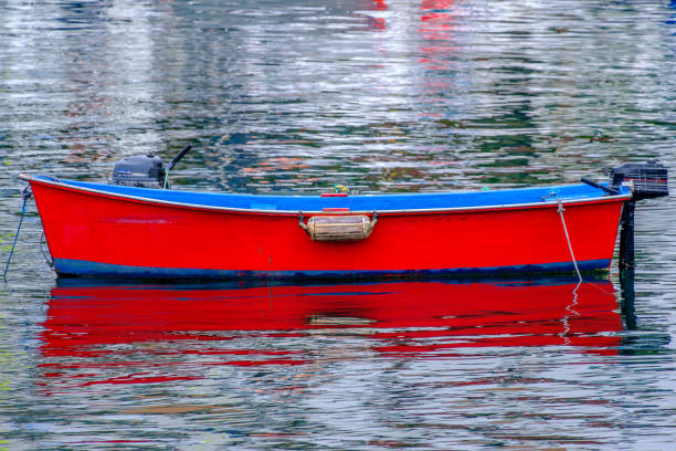 istock Lone rowboat moored in harbor 1744726584