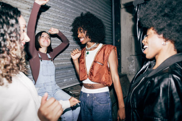Group of multi ethnic friend enjoying New York nightlife Group of multi ethnic friend enjoying New York nightlife and gathering for a reunion. alternative lifestyle stock pictures, royalty-free photos & images