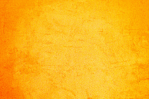 Old cloth texture background light brown orange gold yellow.