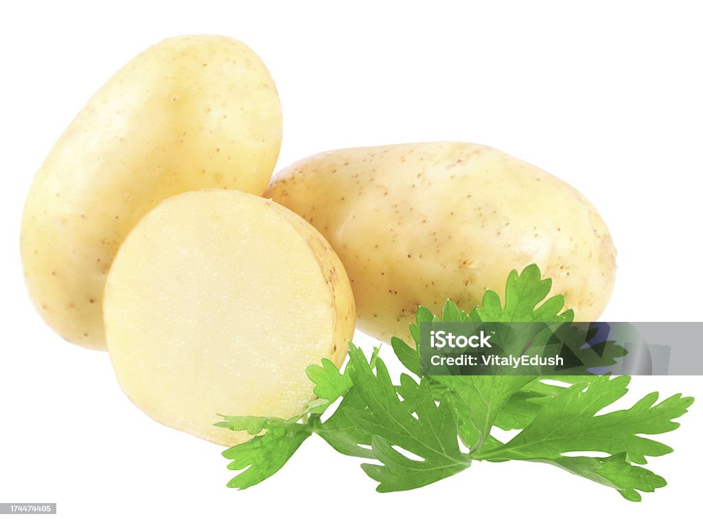 Jeunes pommes de terre, décorer de persil. Isolé - Photo de Agriculture libre de droits