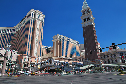 Las Vegas, United States - November 24, 2022: A picture of Las Vegas at night, showing the MGM Grand and the Tropicana Las Vegas - a DoubleTree by Hilton Hotel.