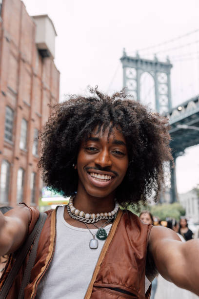istock Gen Z man taking a selfie in DUMBO, New York 1744749071