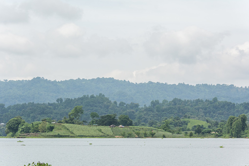 A breathtaking view of the lake, surrounded by verdant hills and a sky that's a masterpiece, in the heart of Rangamati, Bangladesh