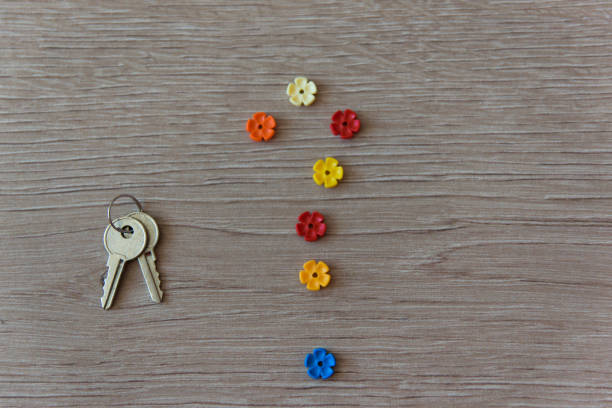 istock Question mark and key on the wood background. 1744750360