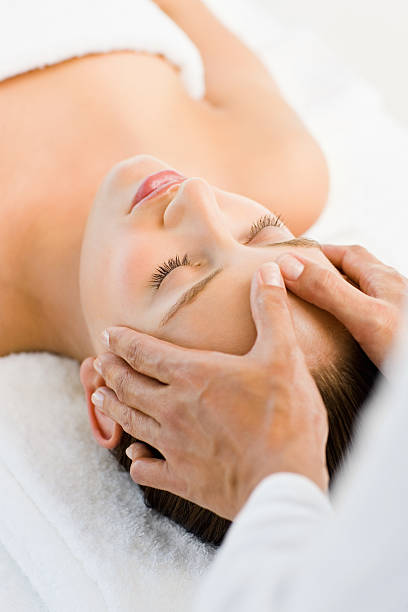 istock Beautiful woman receiving head massage at spa 174477172
